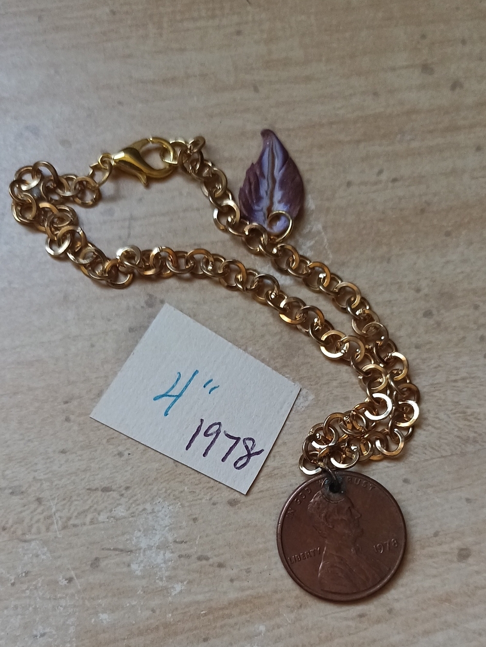 Gold-Tone Chain Bracelet with 1978 Penny Charm and Purple Leaf Accent